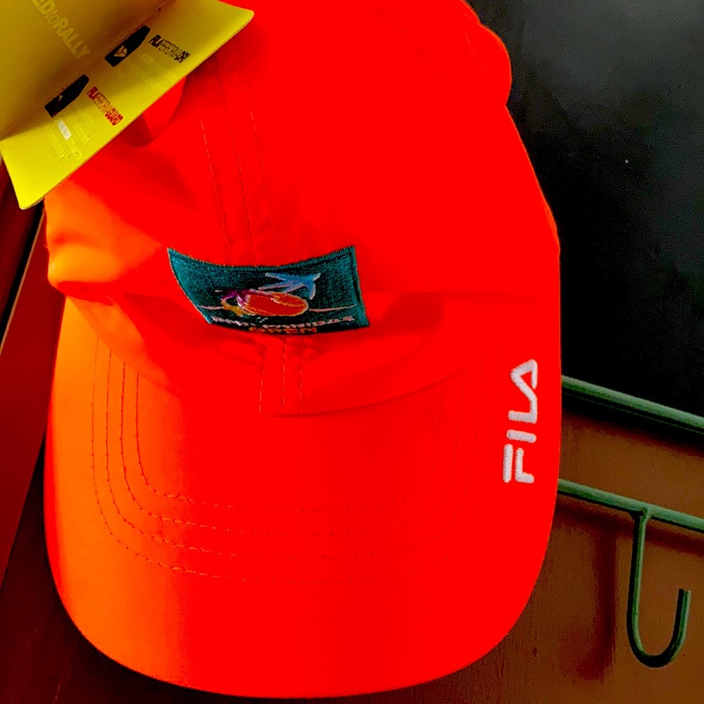 Bright Orange Fila Perform DRI Hat BNP Open.